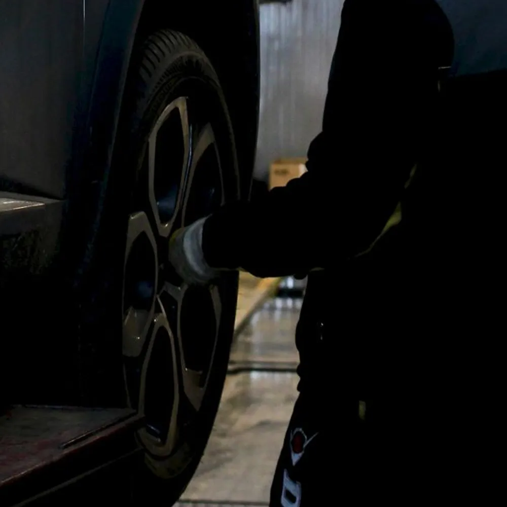 Close-up of work on a car wheel